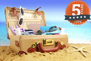 Full open suitcase on tropical beach background